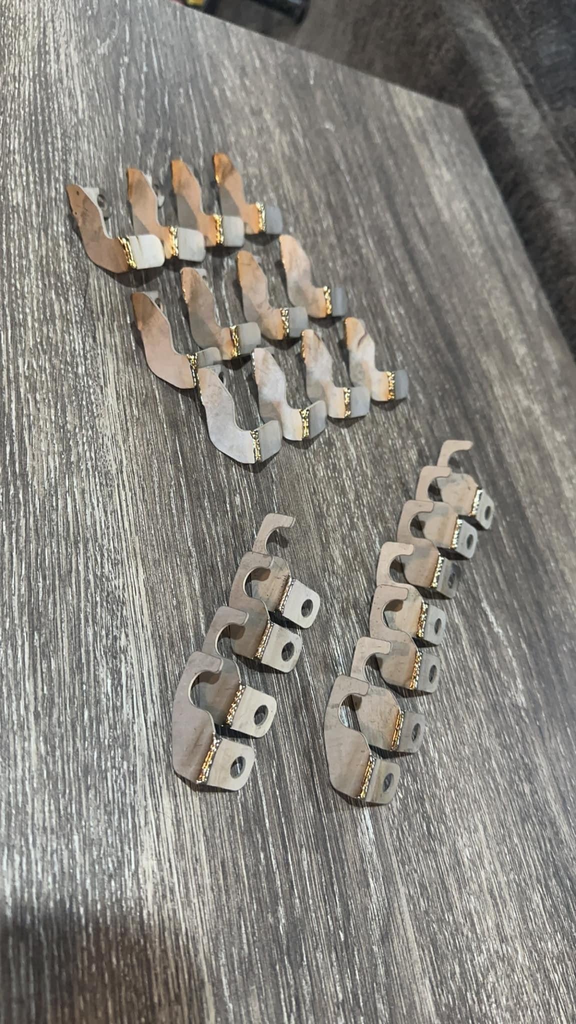 Titanium Banshee clutch cable/ arm hold down tabs..